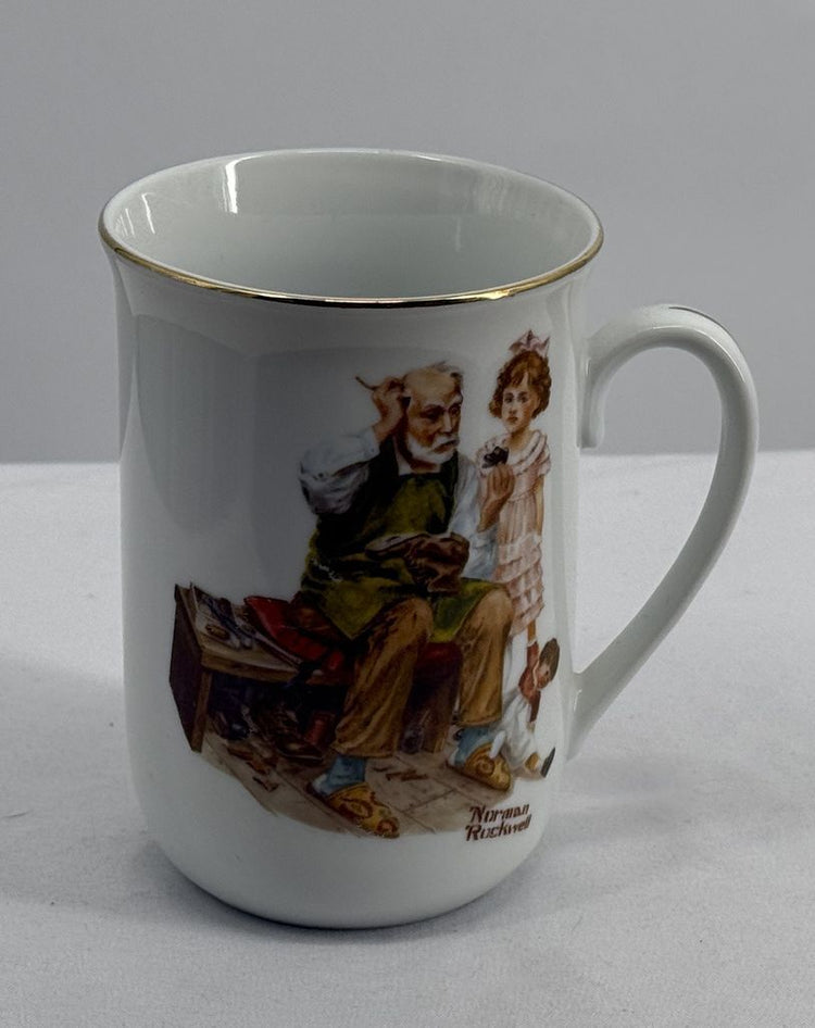 Norman Rockwell The Cobbler Porcelain Coffee Mug with Gold Rim, 1982