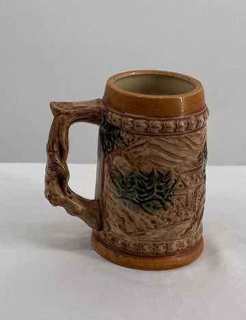 Vintage Ceramic Beer Stein Mug with Scenic Relief Design and Tree Handle