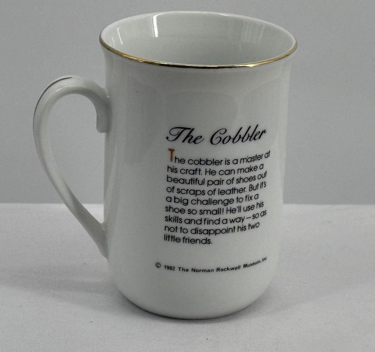 Norman Rockwell The Cobbler Porcelain Coffee Mug with Gold Rim, 1982